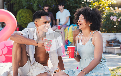 Image of Summer, pool party and couple of friends with drinks outdoor with social celebration and happiness. Event, alcohol and young people relax on the floor talking with friend communication laughing