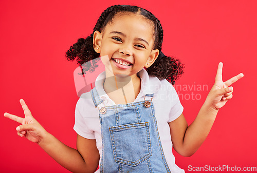 Image of Happy, peace sign and portrait of girl smile on red background with trendy, stylish and cute summer outfit. Kids fashion, freedom and face of child with emoji, comic and meme hand gesture in studio