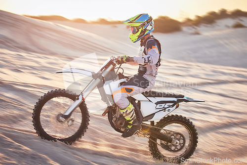 Image of Motorcycle, athlete and sports outdoor with speed, fitness and riding in desert with extreme sport, fast and safety helmet. Challenge, power and biking exercise, person training and dirt bike rally