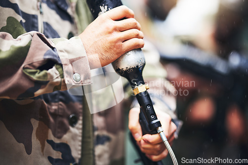 Image of Closeup paintball gun, hands and man with camouflage clothes, ready and start for outdoor combat game. Weapon, war games and adventure for training, shooting and workout for tactical development