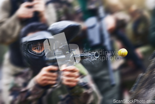 Image of Paintball gun zoom, smoke and shooting with action, speed and military battlefield with soldier, war and fitness outdoor. People together in camouflage, mask with weapon and game, power and sports