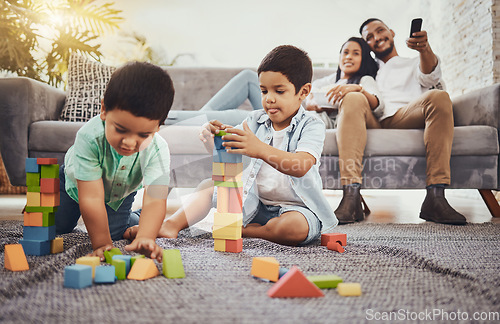 Image of Building blocks, family or children learning for development growth with mother and father relaxing watching tv. Education, siblings or young boys playing fun toys or games for kids at home together
