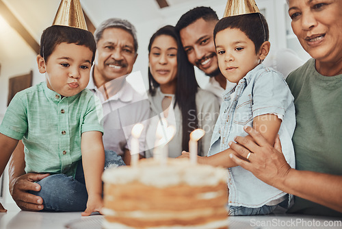 Image of Birthday, family and children with parents and grandparents in a kitchen for cake, celebration and bonding. Party and kids with mother and father, happy and smile with grandmother and grandpa