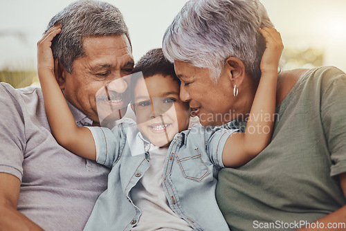 Image of Family, portrait and child with grandparents in a living room, hug and happy, love and sweet while bonding in their home. Embrace, grandchild and grandmother with grandfather in a lounge hugging