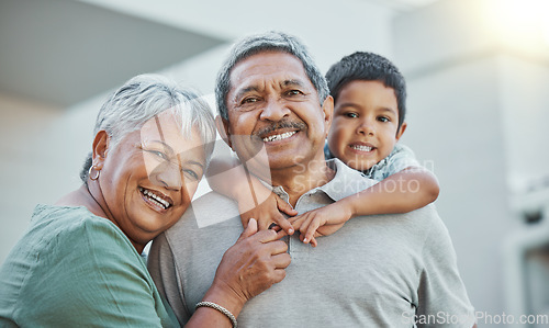 Image of Grandpa, grandma and child hug with smile for happy holiday or weekend break with grandparents at the house. Portrait of elderly people holding grandchild on back for fun playful summer together