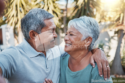 Image of Senior, selfie and outdoor couple with love, happiness and care with a smile in garden. Happy retirement, profile picture and hug of elderly people enjoying life and marriage in summer feeling relax