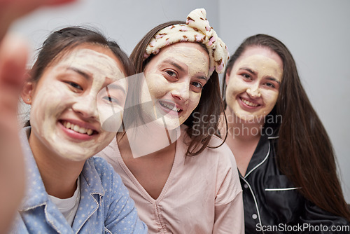 Image of Friends, women and sleepover with mask, selfie and bonding with cosmetics, smile and quality time. Females, girls and photo for posting, dermatology or skincare with ladies, treatment or fun together