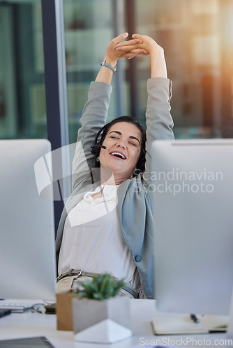 Image of Call center, woman and tired with stretching in office by computer with smile, relax or customer service. Crm expert, telemarketing and consulting for tech support with stress relief, muscle or happy