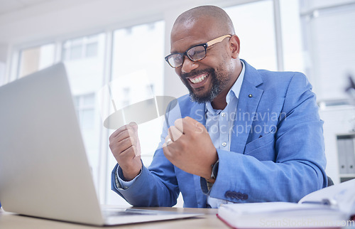 Image of Black man, laptop and fist celebration in office for web design success, happiness or winner achievement. African businessman, celebrate and happy hands for online communication on digital device