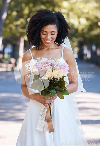 Image of Happy, wedding and smile with bride and flowers for beauty, celebration and spring event. Happiness, makeup and fashion with black woman and rose bouquet for marriage, party and outdoor ceremony