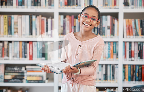 Image of Girl, library book and portrait of a school student ready for learning, reading and studying. Children, knowledge development and education center with a study bookshelf and kid with a happy smile