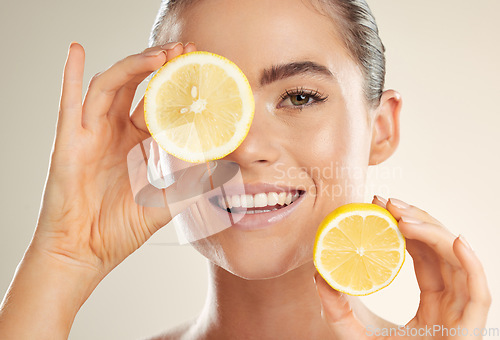 Image of Beauty, face portrait and happy woman with lemon for natural fruit detox, health wellness or facial skincare glow. Spa salon, dermatology healthcare and nutritionist model with vitamin c food product
