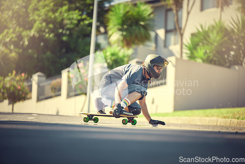 Image of Skateboard, street and mock up with a sports man skating or training outdoor while moving at speed for action. Fitness, exercise and road with a male skater or athlete outside to practice his balance