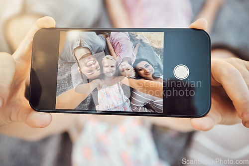 Image of Phone screen, hands and family selfie portrait of hand with mobile zoom and smile on ground. Children, parents and happy together with love and care using a cellphone photo with kids on holiday