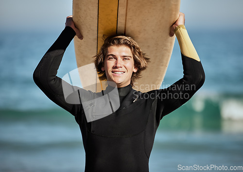 Image of Fitness, beach and portrait of a surfer with a surfboard for exercise, fun and adventure on vacation. Water sports, travel and man athlete surfing by the ocean on a tropical holiday in Australia.