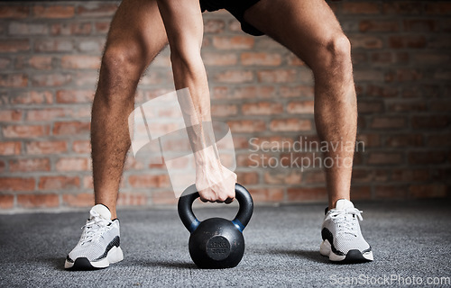 Image of Kettlebell training, exercise and man hands for weightlifting, fitness workout and sports challenge in gym. Closeup of athlete, body builder and holding heavy weights for wellness, muscle and power