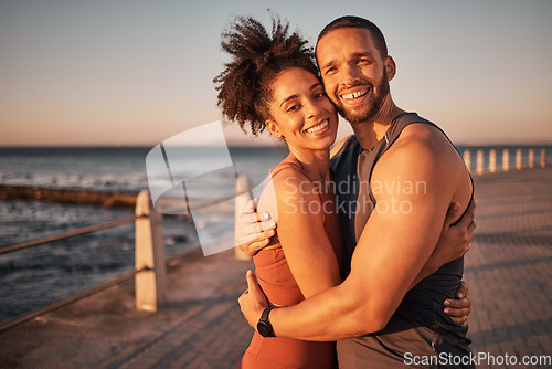 Image of Fitness, love and portrait with couple and hug at beach for workout, exercise and health partner. Wellness, sunset and smile with man and woman training for, running, marathon and cardio endurance