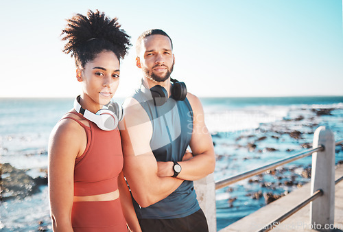 Image of Portrait, exercise and serious with a couple by the sea for a workout or running for cardio and endurance together. Fitness, runner and mockup with a sports man and woman training by the ocean