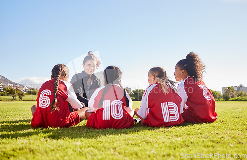 Image of Team building, planning or coach with children for soccer strategy, training and sports goals in Canada. Sport, friends and woman coaching group of girls on football field for game, match or workout