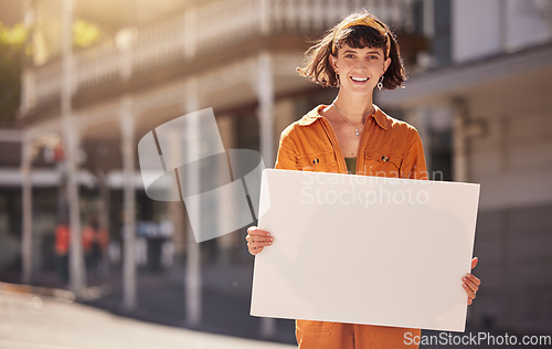 Image of Woman, lgbt and board poster in city, smile and portrait for human rights, non binary and opinion. Gen z activist girl, pride march, parade and outdoor in urban metro for lgbtq, equality and peace