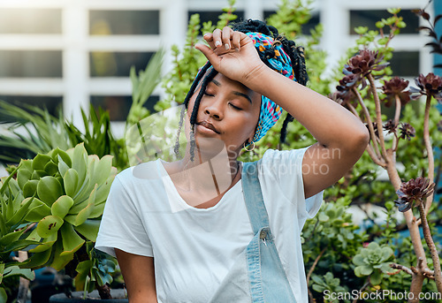 Image of Tired, gardener or black woman with fatigue, burnout or stress after cleaning dirty plants or flowers. Gardening, sweating or exhausted girl resting after working on environmental maintenance job