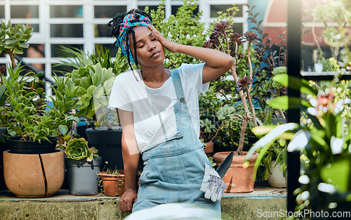 Image of Tired, gardener or black woman with headache, stress or burnout after cleaning dirty plants or flowers. Gardening, fatigue or exhausted girl resting after working on environmental maintenance job