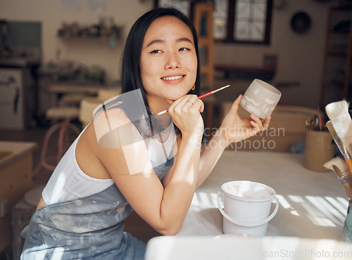 Image of Woman, potter or thinking of product design ideas, cup painting vision or creative color in Asian pottery studio. Smile, happy or clay store worker and mug goals, small business or ceramic workshop