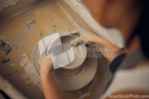 Image of Clay, pottery or hands in workshop studio working on a cup sculpture or mug mold in small business. Creative, artistic person or talented worker manufacturing handicraft products in designing process