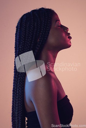 Image of Calm, beauty and profile of black woman in studio with braids, makeup and cosmetic routine. Relax, cosmetics and African female model with relaxing, peace and zen mindset isolated by pink background.