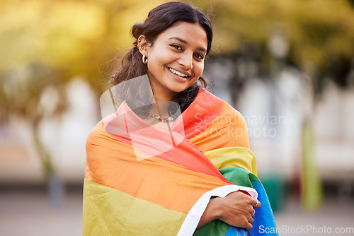 Image of Love, nature and portrait of woman in pride flag, smile and non binary lifestyle of freedom, peace and equality in Brazil. Rainbow, park and summer, happy girl in gay and lgbt community protest.