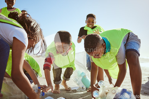 Image of Beach, recycle and group of children cleaning the environment for volunteer, charity or ngo support, help and teamwork. Diversity friends or students recycling plastic for pollution or earth day