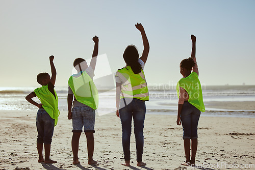 Image of Teamwork, recycle and hands of volunteer at the beach for cleaning, recycling and earth day. Community, charity and support with fist of people for environment, eco friendly and sustainability change