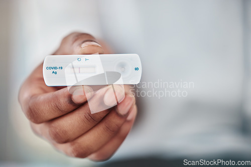 Image of Rapid exam and black man hand with covid test for quick viral detection and healthcare check. Corona virus pcr and results of person with medical kit at hospital or virus testing clinic zoom.