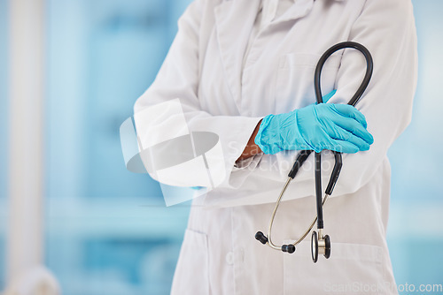 Image of Cardiology, stethoscope and proud doctor hands for healthcare, heart wellness and insurance in hospital. Medical blurred background, professional and cardiologist with career equipment in clinic zoom