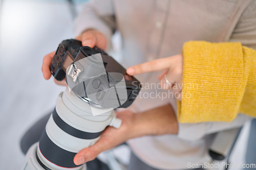 Image of Camera, hands and photography for a digital agency or magazine company looking at tech setting. Employee, model and photographer review photo quality in a studio busy with creative working for art