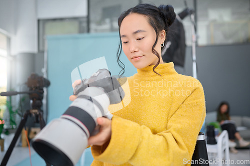 Image of Photography camera, asian woman and digital agency worker review pictures in a studio. Photographer, production process and professional photoshoot with a creative employee checking catalog results