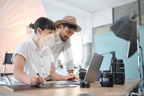 Image of Happy, planning and photographers with work on a laptop, photo shoot results and helping in studio. Teamwork, collaboration and man and woman working on creative photography with inspiration from pc