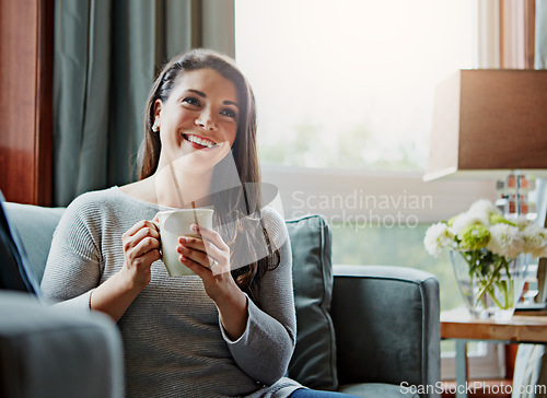 Image of Coffee, woman and smile of a relax person at home on a living room sofa relaxing in the morning. Thinking, happy female and lens flare on a lounge house couch with tea feeling happiness with a mug