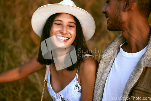 Image of Couple, love and happy people smiling and travel together enjoying an outdoor date during sunset. Young man and woman on a romantic vacation on a morning walk feeling happiness in summer