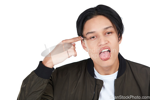 Image of Portrait, rude and crazy with an asian man in studio isolated on a white background pointing at his head. Face, angry and frustrated with a young male on blank space making a gesture in disrespect