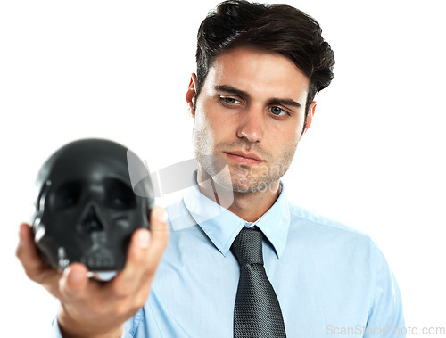 Image of Hand, black and skull by businessman in studio for death, symbol and failure against white background. Horror, fail and man showing human head for manipulation, emoji and bad luck while isolated