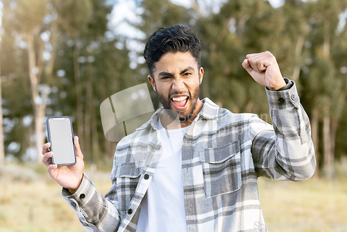 Image of Phone mockup, portrait and man excited for nature adventure, forest hiking or celebrate outdoor woods journey. UI screen mock up, digital product placement and happy person cheer, fist pump and shout