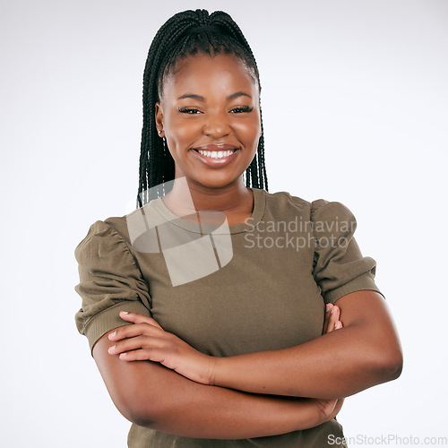 Image of Black woman, portrait and smile with arms crossed in studio with casual style, fashion and confidence. Happy young female model, empowerment and happiness with hair braids, beauty or pride in Nigeria