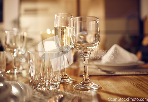 Image of Drink, glass and dinner with party, celebration event with glassware, elegant and luxury in restaurant or banquet. Table setting, alcohol and lifestyle, fine dining with decoration and celebrate