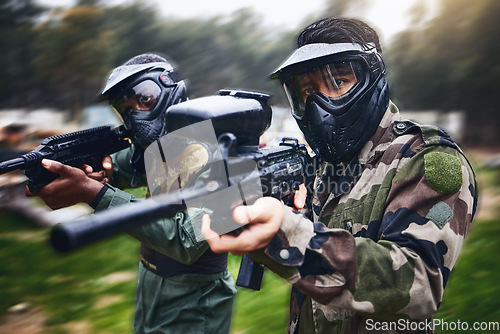 Image of Training, paintball gun and men in camouflage with safety gear at military game for target practice. Teamwork, shooting sports and war games, play with rifle and friends working together at army park