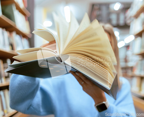 Image of Education, book and pages in a library for reading for knowledge, learning or studying. Information, books and woman looking at paper in a novel or story at a book store to study, learn or read.