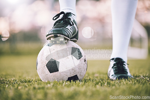 Image of Soccer ball, football player shoes and grass field of athlete feet ready for exercise and sport. Fitness, lawn and sneakers for goal training, health and workout sports for arena game outdoor