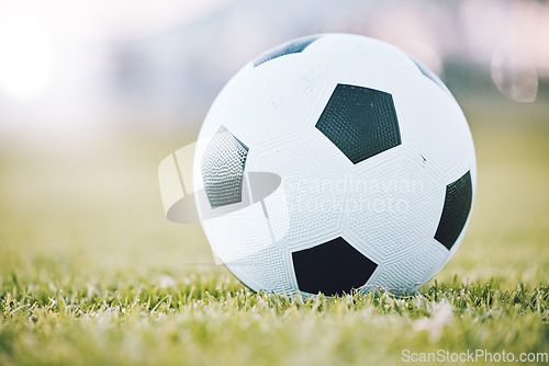 Image of Soccer, ball and field ready for kickoff, game time or match start in sports, athletics or tournament in the outdoors. Round sphere object with pentagon shape spots on green grass for sport on mockup