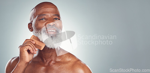 Image of Grooming, comb and beard with face of black man for beauty, hygiene and skincare with mockup. Self care, facial hair and barber with model for health, wellness and cleaning in studio background