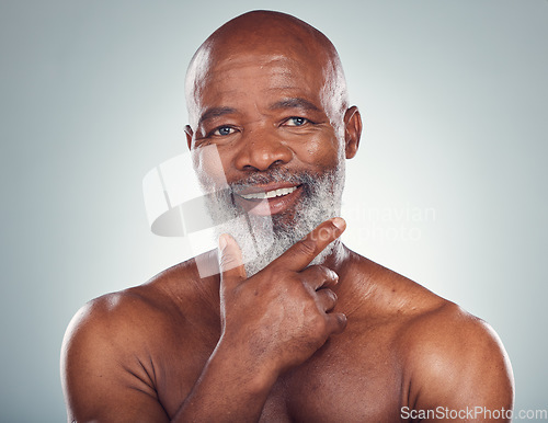 Image of Portrait, black man and skincare for cosmetics, dermatology and guy on grey studio background. Face detox, African mature male and senior gentlemen with grooming routine, treatment and smooth skin